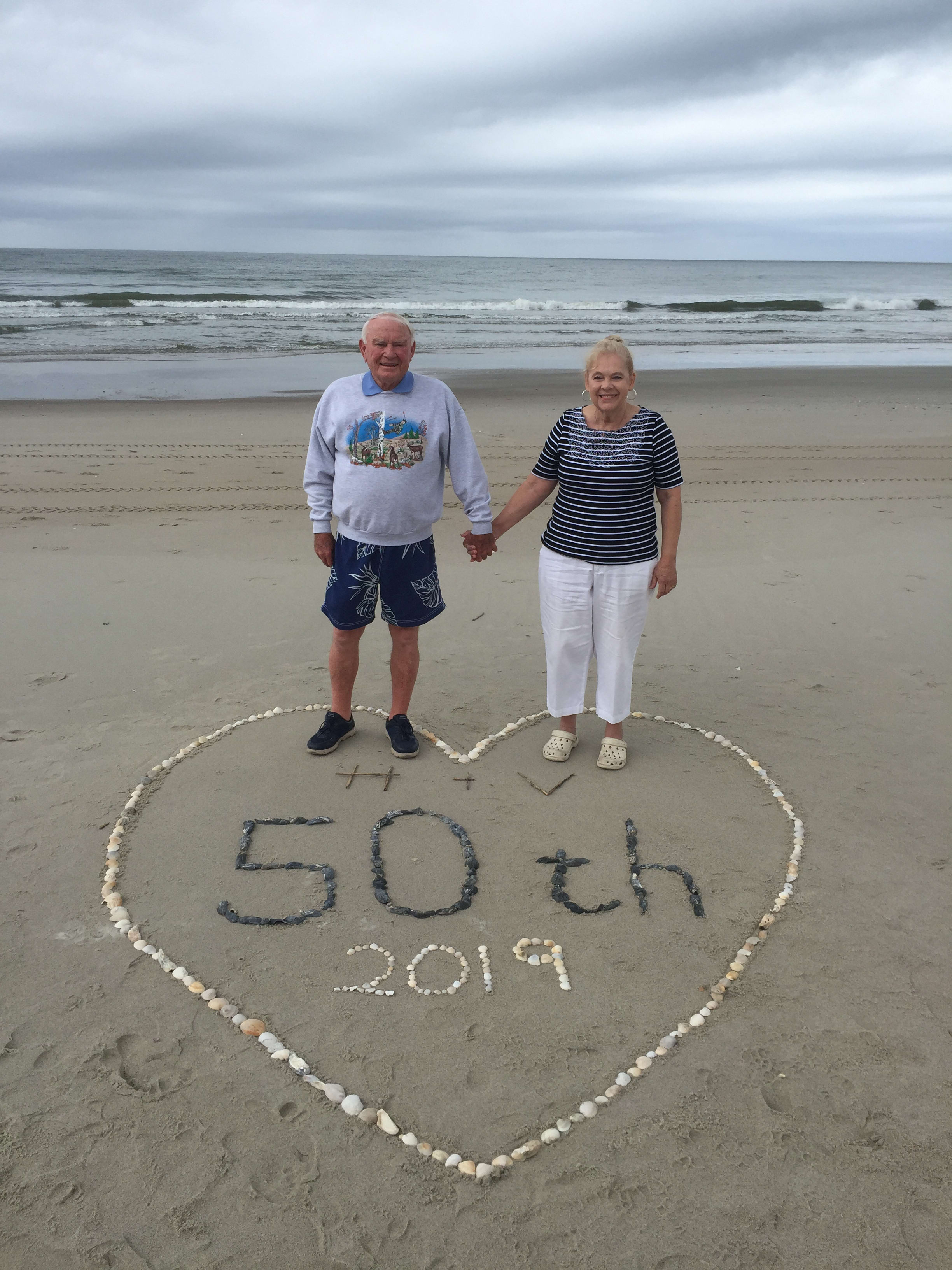 Couple celebrating their 50th wedding anniversary on Holden Beach