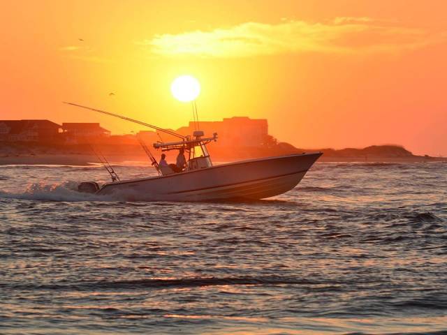 fishing boat at sunset